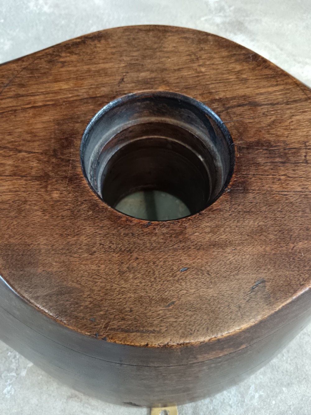 A carved two-blade dark mahogany timber aircraft propeller with a central mounting hole. View VIII