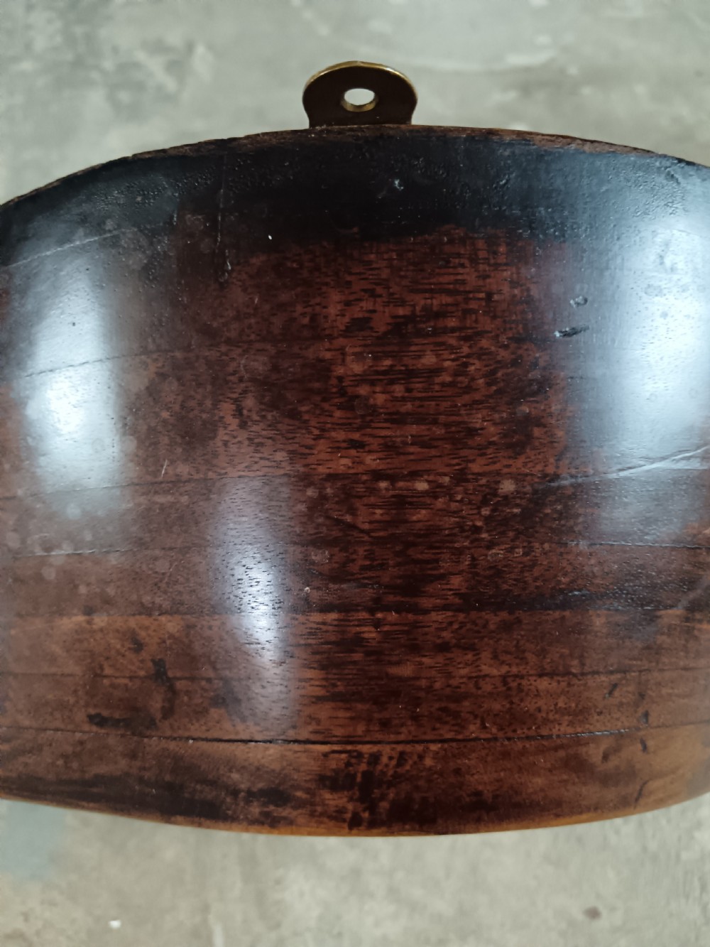 A carved two-blade dark mahogany timber aircraft propeller with a central mounting hole. View XV