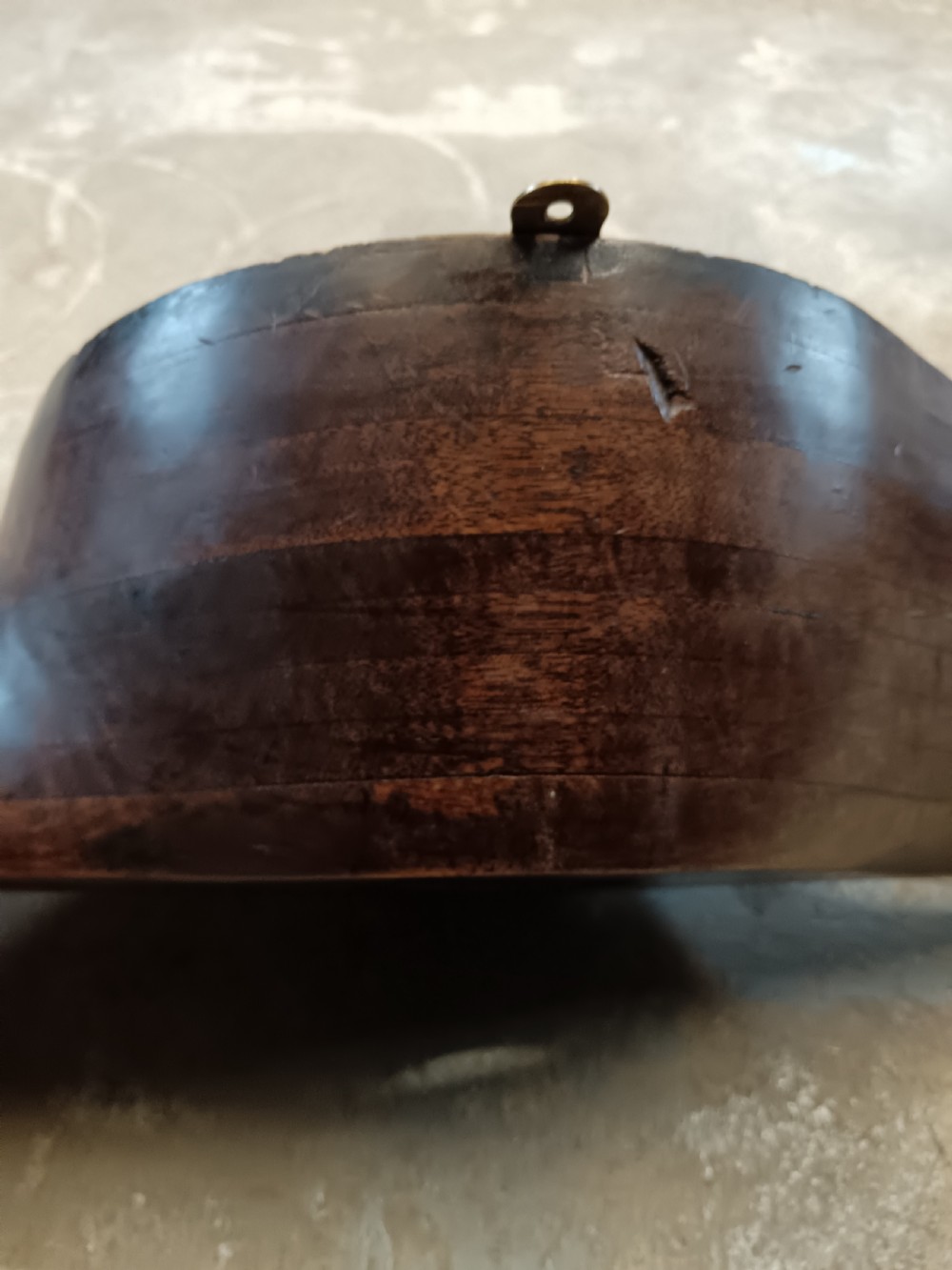 A carved two-blade dark mahogany timber aircraft propeller with a central mounting hole. View XVI