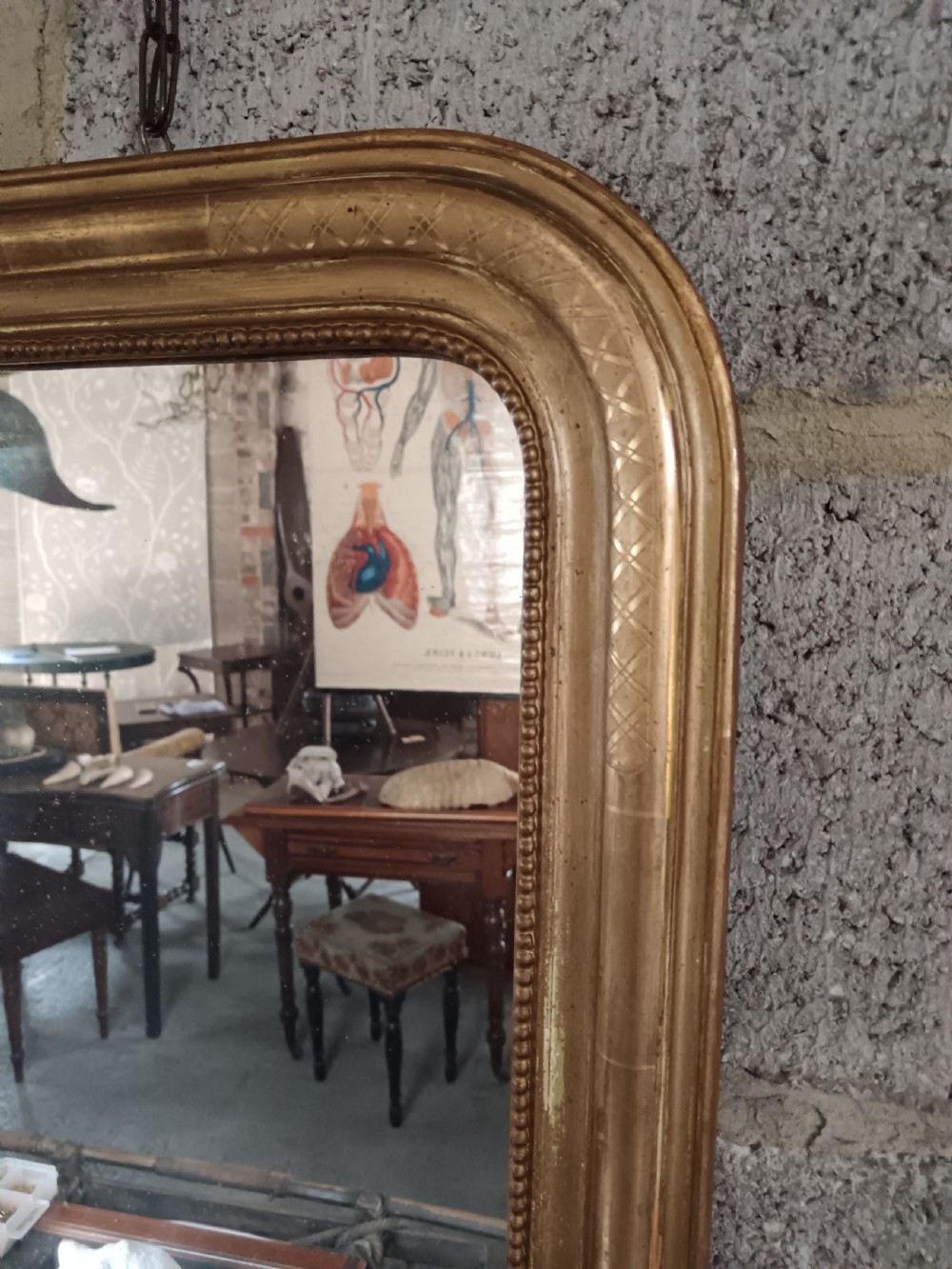 A 19th-century French arched wall mirror featuring a giltwood frame with rounded top corners and beaded inner trim. View V