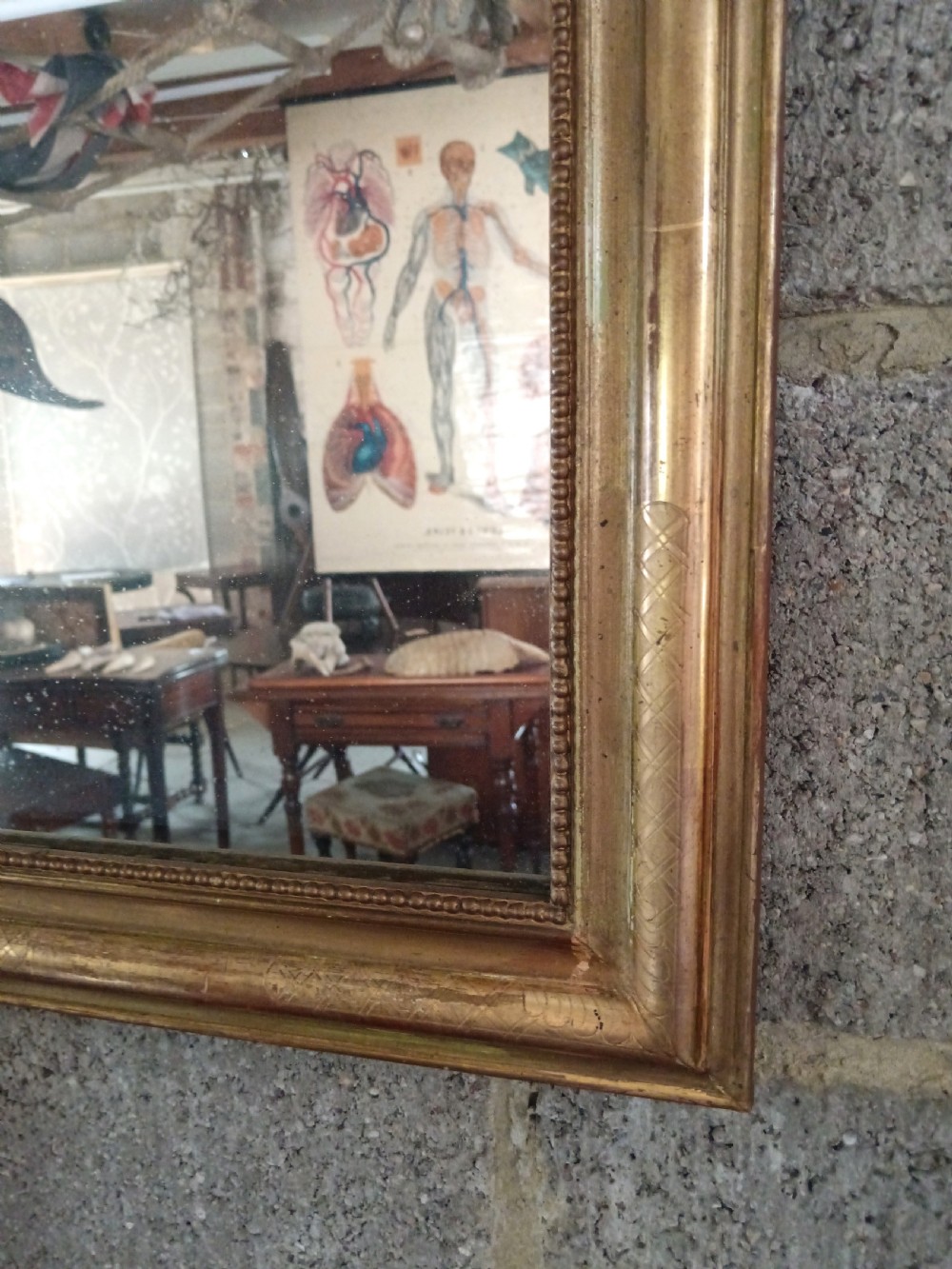 A 19th-century French arched wall mirror featuring a giltwood frame with rounded top corners and beaded inner trim. View VII