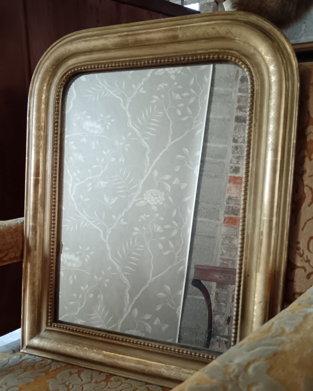 A 19th-century French arched wall mirror featuring a giltwood frame with rounded top corners and beaded inner trim. View VIII