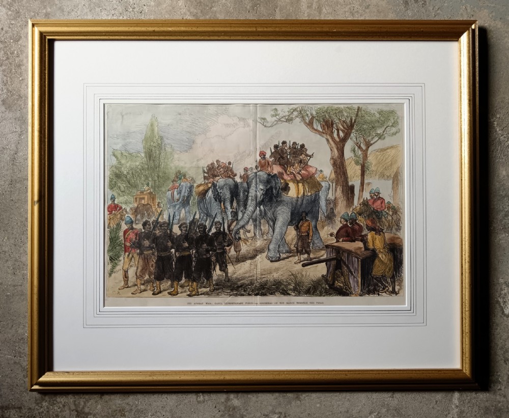 Framed hand-coloured Victorian wood engraving depicting soldiers and elephants marching through a landscape during the Second Anglo-Afghan War. View II