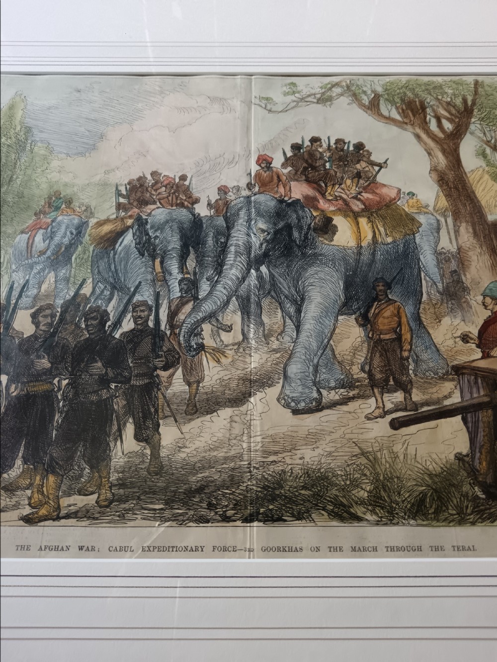 Framed hand-coloured Victorian wood engraving depicting soldiers and elephants marching through a landscape during the Second Anglo-Afghan War. View III