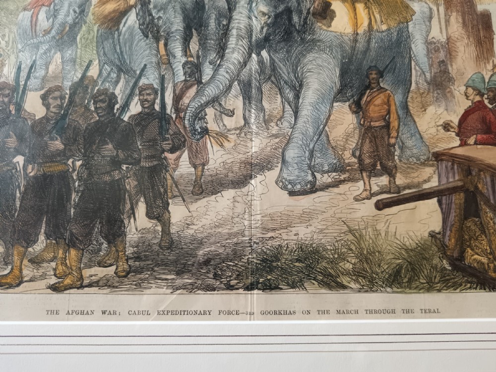 Framed hand-coloured Victorian wood engraving depicting soldiers and elephants marching through a landscape during the Second Anglo-Afghan War. View IV