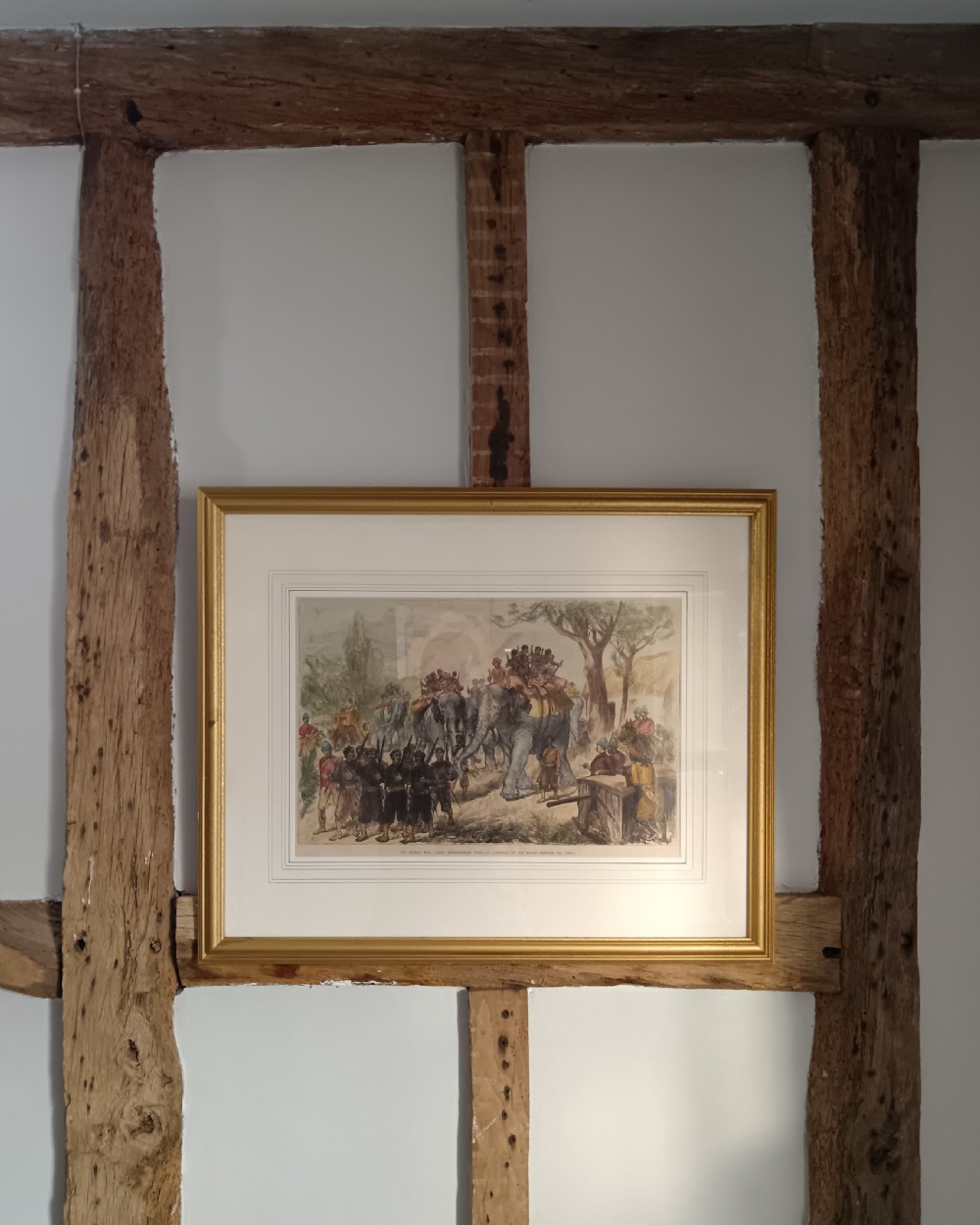 Framed hand-coloured Victorian wood engraving depicting soldiers and elephants marching through a landscape during the Second Anglo-Afghan War. View V