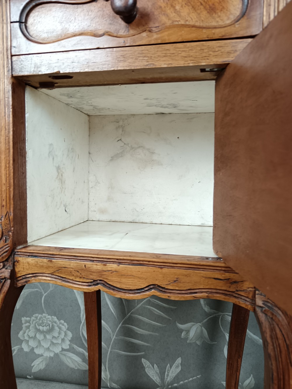 A tall French bedside cupboard crafted from warm brown wood with slim cabriole legs, parquetry panels, a single top drawer, and a lower cabinet door. View XI