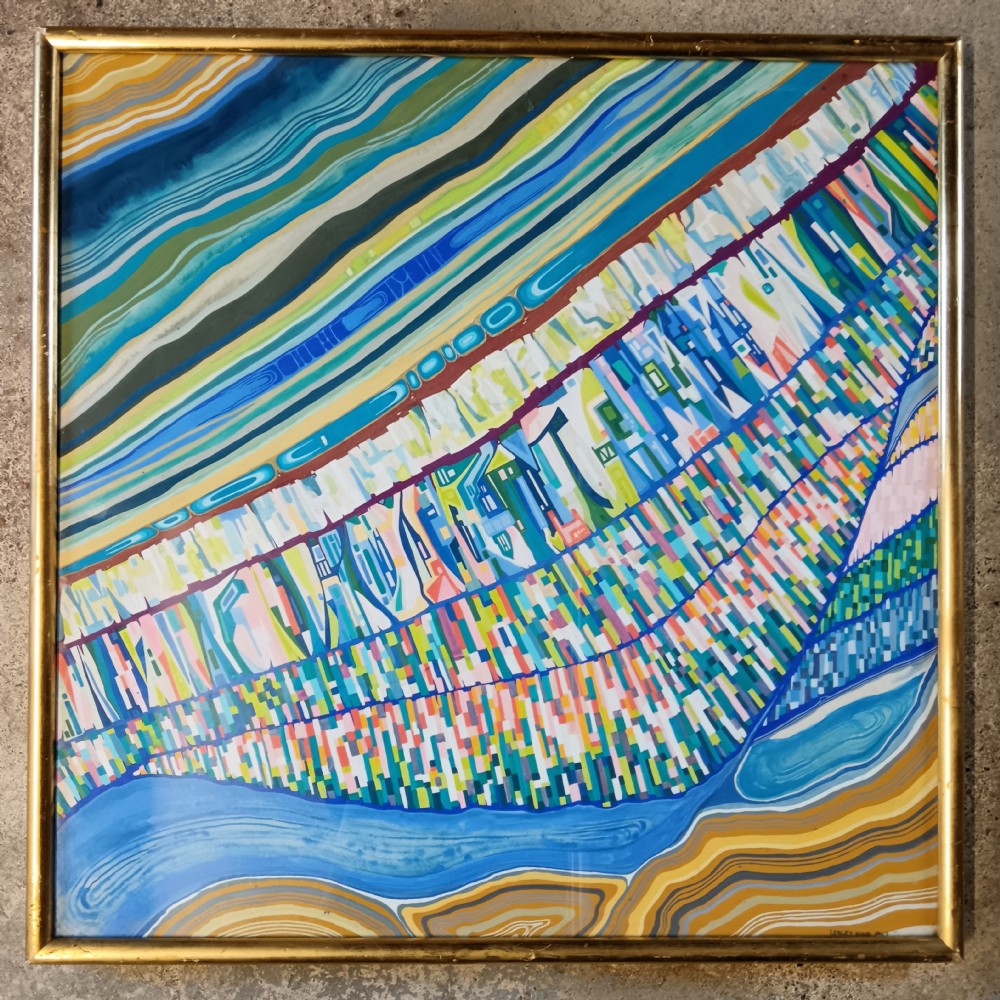 A framed abstract landscape painting featuring vibrant, stylized diagonal bands of blue, green, yellow, and colourful geometric patterns in a slim gold frame.