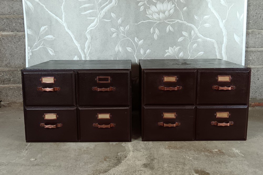 A dark brown modular card index filing cabinet featuring multiple drawers with copper handles and metal label holders. View XI