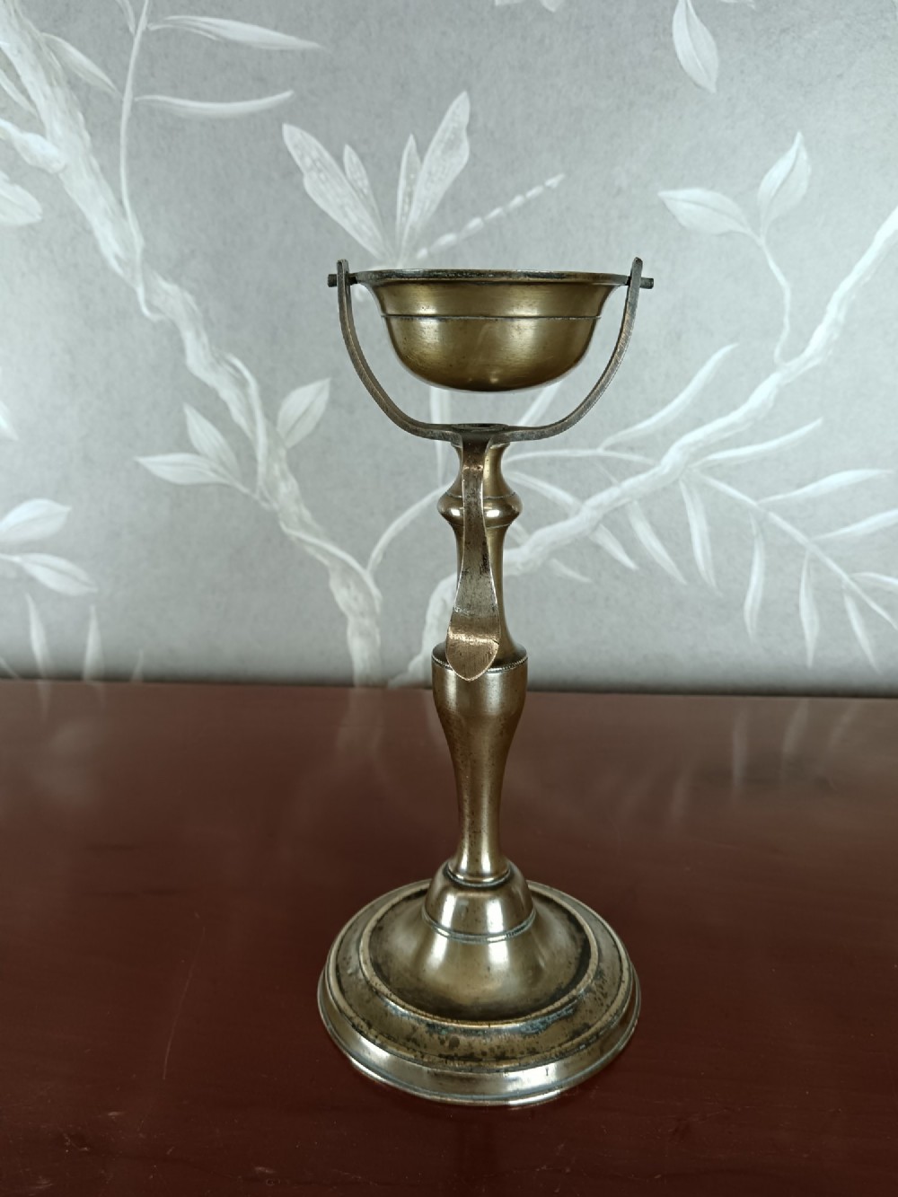 Antique brass oil lamp with a gimballed (swivelling) bowl