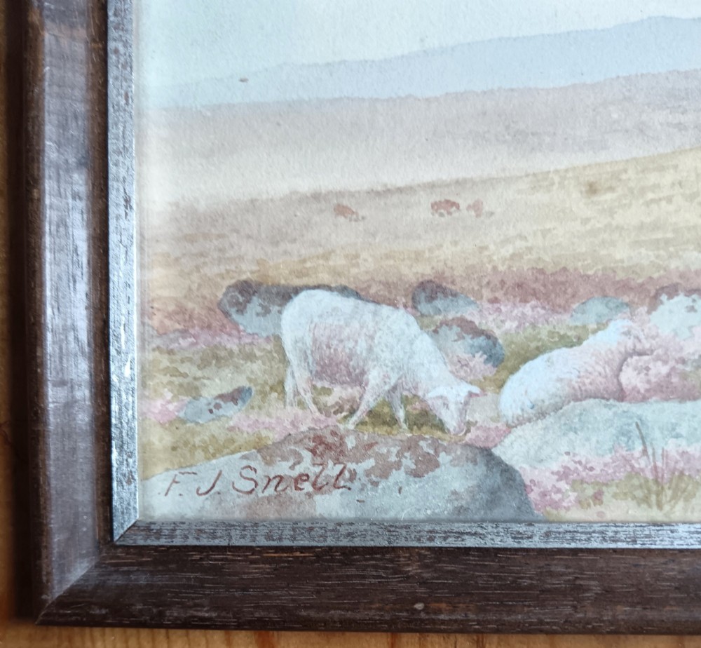 A pair of framed Edwardian watercolour paintings depicting rocky British moorland landscapes with grazing sheep under cloudy skies. View IV