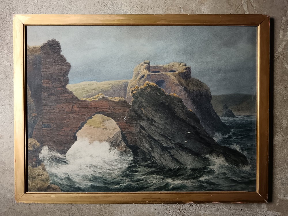 An antique framed watercolour painting depicting crashing ocean waves against a rocky arch and cliff under an overcast grey sky.