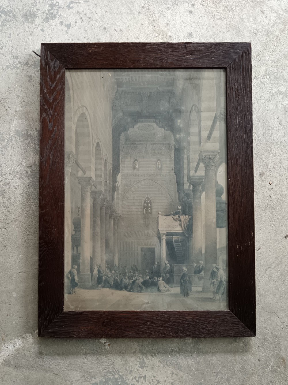 A pair of 19th-century sepia lithographs depicting architectural street and interior scenes of Cairo, mounted in dark oak frames. View IV