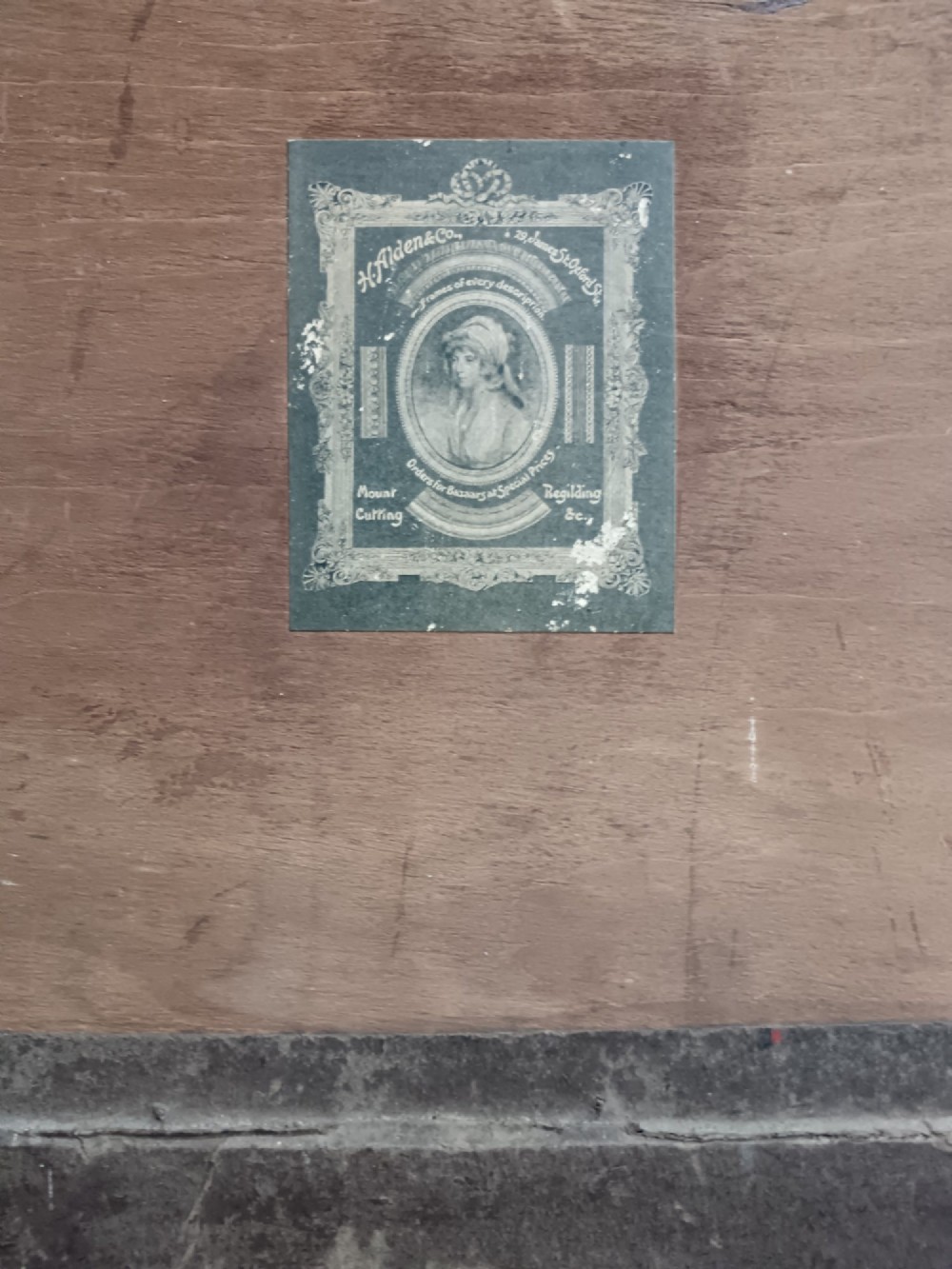A pair of 19th-century sepia lithographs depicting architectural street and interior scenes of Cairo, mounted in dark oak frames. View XI