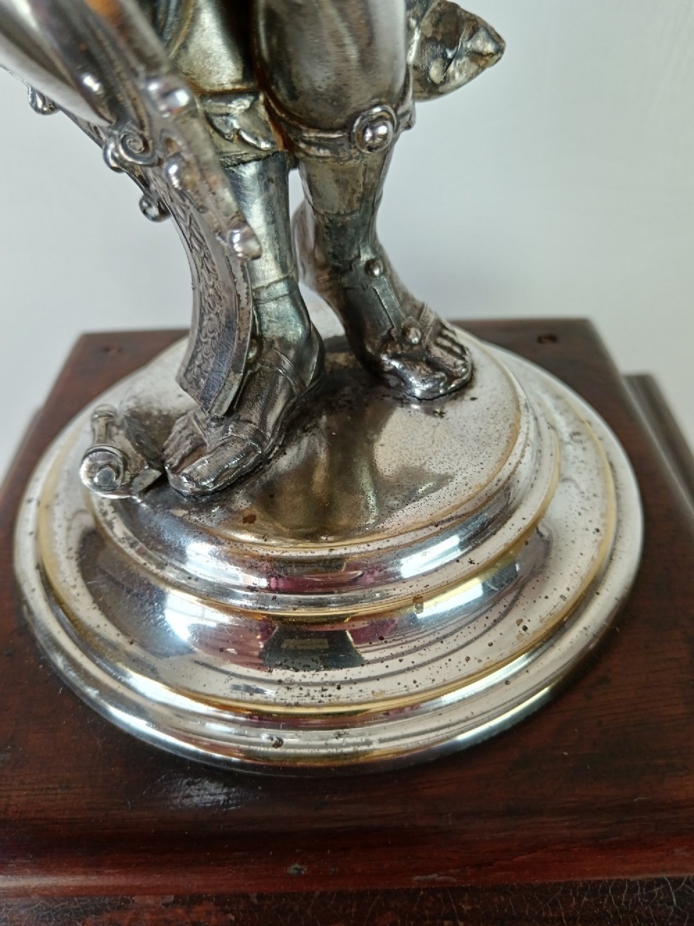 A dark wood tapered fluted pedestal column topped with a silver-plated classical female figural lamp fixture. View IX