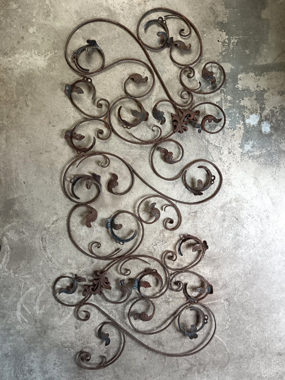 A pair of weathered wrought iron scroll panels featuring detailed acanthus leaves and a naturally oxidized brown finish. View II