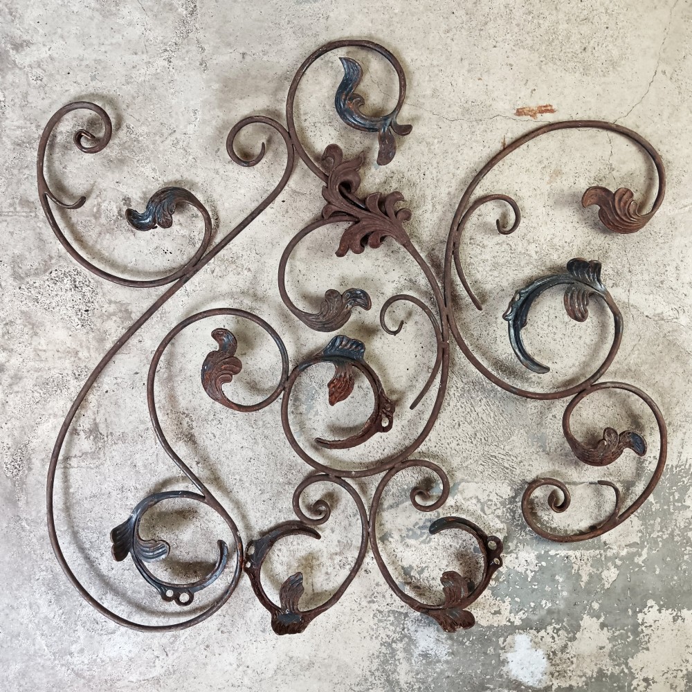A pair of weathered wrought iron scroll panels featuring detailed acanthus leaves and a naturally oxidized brown finish. View III