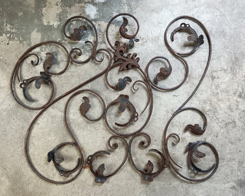 A pair of weathered wrought iron scroll panels featuring detailed acanthus leaves and a naturally oxidized brown finish. View IV
