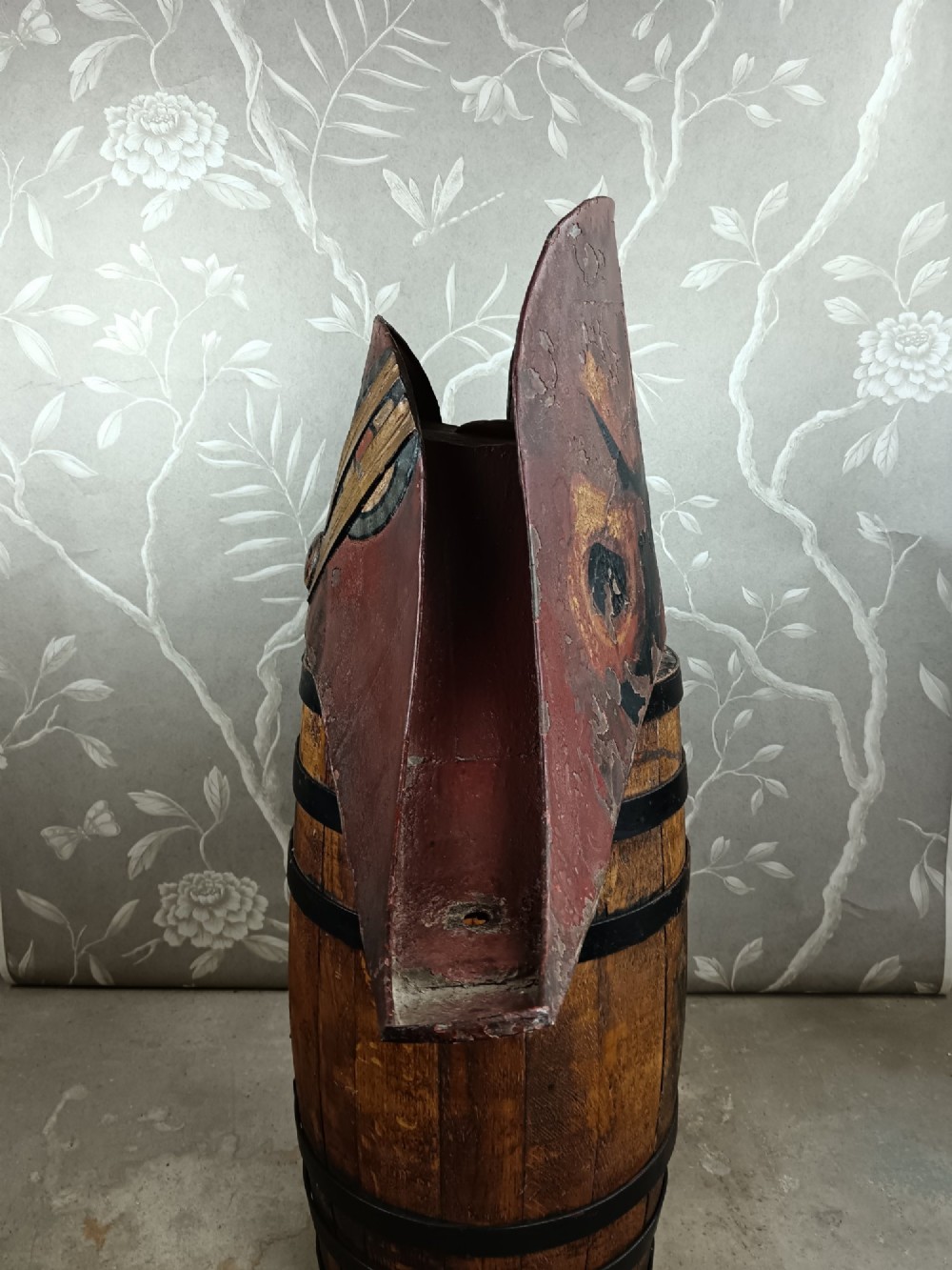 A nineteenth-century painted toleware trade sign shaped in the form of a military bicorn hat with gilt detailing. View VII