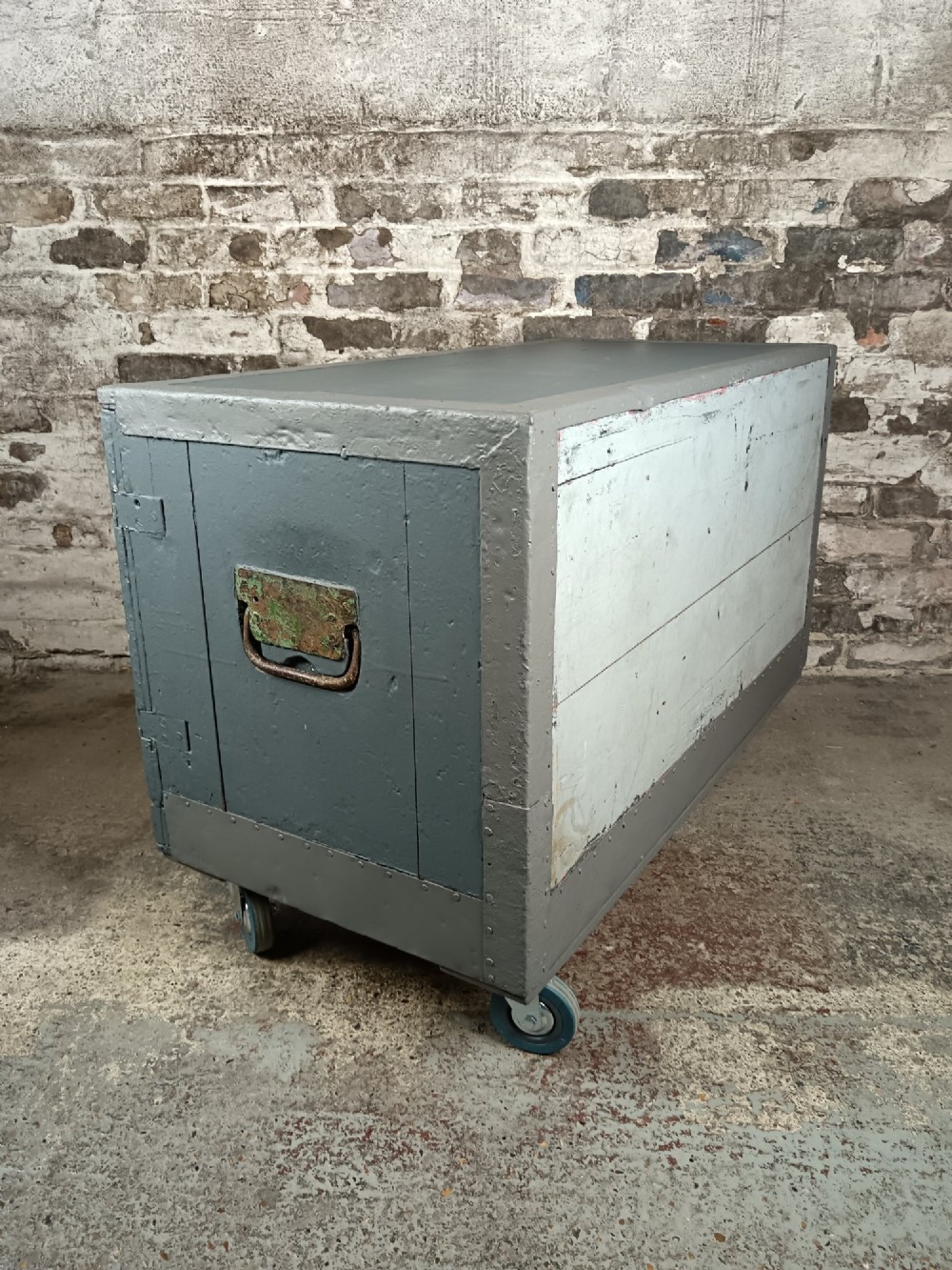 A 19th-century wooden military transport packing case featuring a slate grey painted finish and panelled front doors set on castors. View VIII