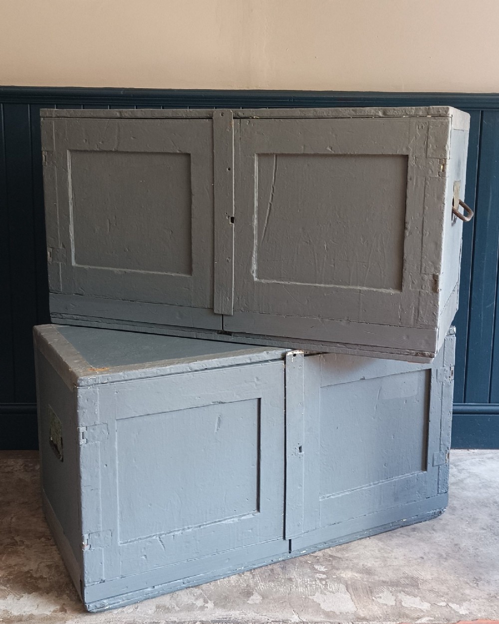 A 19th-century wooden military transport packing case featuring a slate grey painted finish and panelled front doors set on castors. View XII