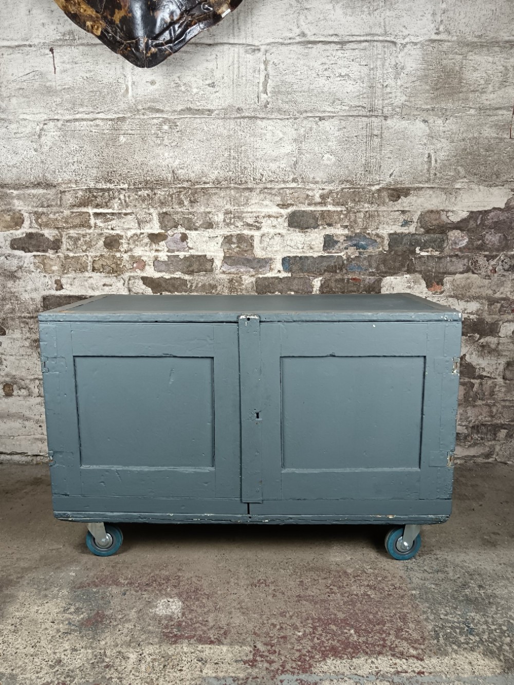 A slate grey painted 19th-century military campaign packing chest with iron flush handles, corner reinforcements, hinged doors, and an internal shelf. View II