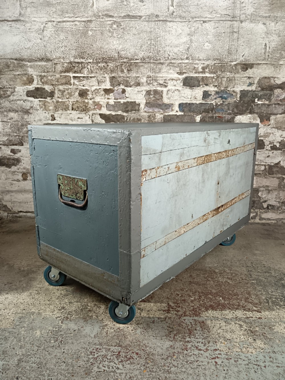 A slate grey painted 19th-century military campaign packing chest with iron flush handles, corner reinforcements, hinged doors, and an internal shelf. View VII