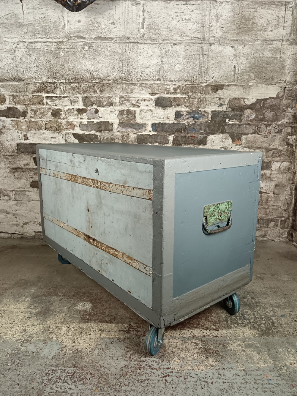 A slate grey painted 19th-century military campaign packing chest with iron flush handles, corner reinforcements, hinged doors, and an internal shelf. View VIII