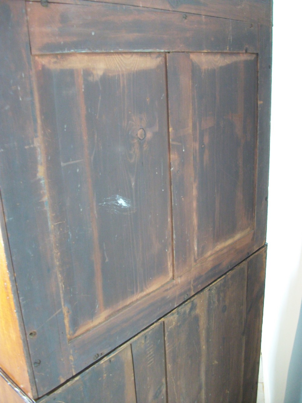 A Regency mahogany secretaire cabinet featuring a triangular pediment top, glazed upper doors, a fall-front desk section, and three drawers below on turned feet. View XII