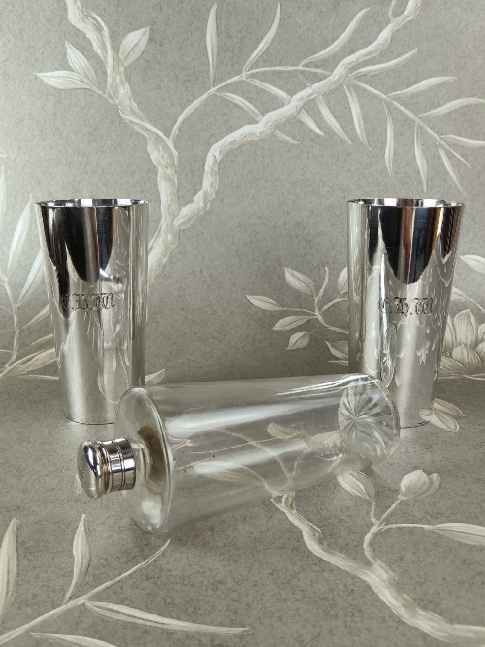 A Victorian leather campaign case with a shoulder strap alongside a glass flask and two silver-plated nesting beaker cups. View IV