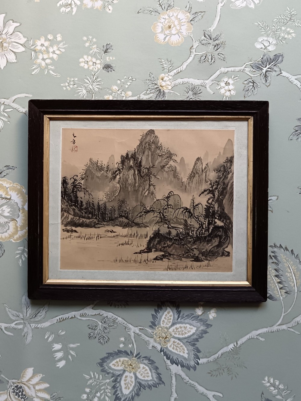 A pair of framed Chinese Shan Shui ink landscape paintings on silk depicting mountainous scenes and trees, presented in dark timber frames with gilded inner trims. View III