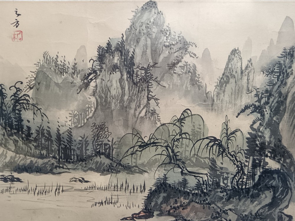 A pair of framed Chinese Shan Shui ink landscape paintings on silk depicting mountainous scenes and trees, presented in dark timber frames with gilded inner trims. View V