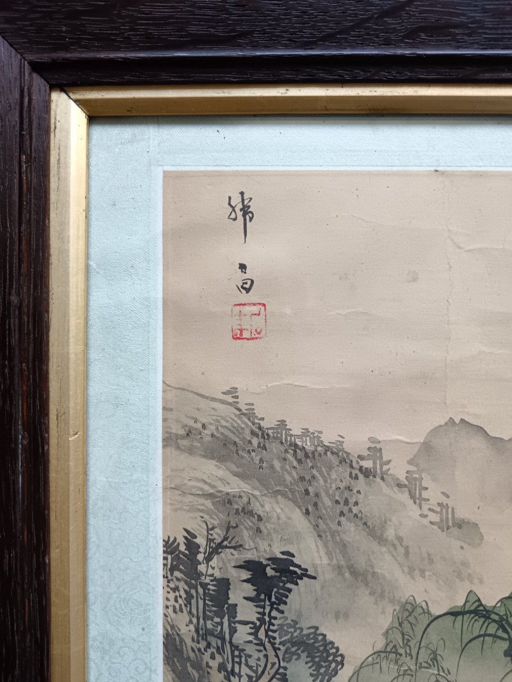 A pair of framed Chinese Shan Shui ink landscape paintings on silk depicting mountainous scenes and trees, presented in dark timber frames with gilded inner trims. View VIII