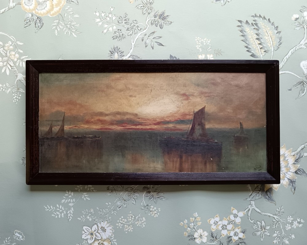 A pair of framed horizontal Edwardian oil paintings depicting atmospheric maritime scenes with sailboats at sunrise and sunset. View III