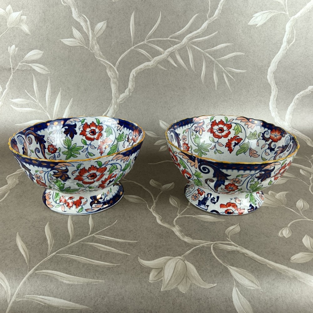 A pair of 19th-century Minton ironstone pedestal bowls with scalloped rims and vibrant Amherst Japan floral transfer pattern in cobalt blue, orange, and green. View II