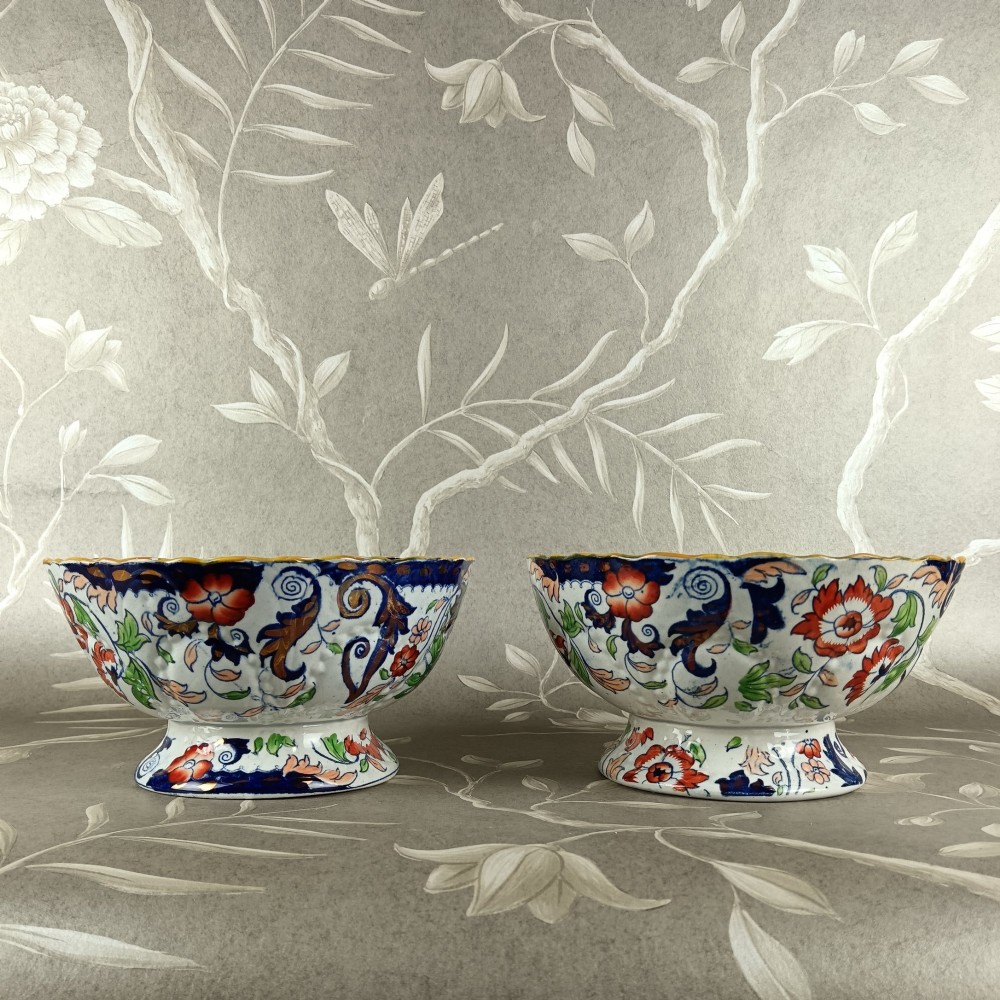A pair of 19th-century Minton ironstone pedestal bowls with scalloped rims and vibrant Amherst Japan floral transfer pattern in cobalt blue, orange, and green. View III