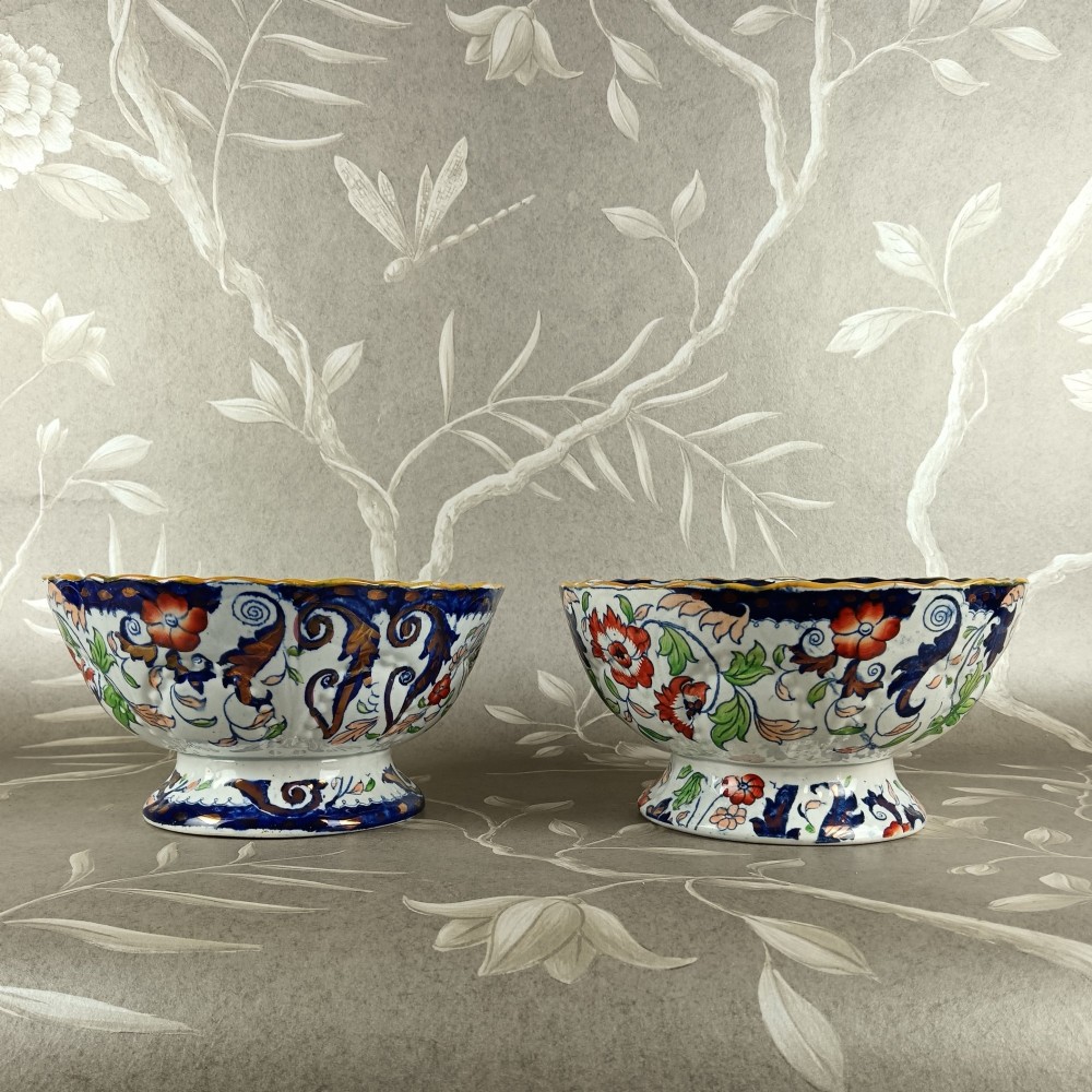 A pair of 19th-century Minton ironstone pedestal bowls with scalloped rims and vibrant Amherst Japan floral transfer pattern in cobalt blue, orange, and green. View VII