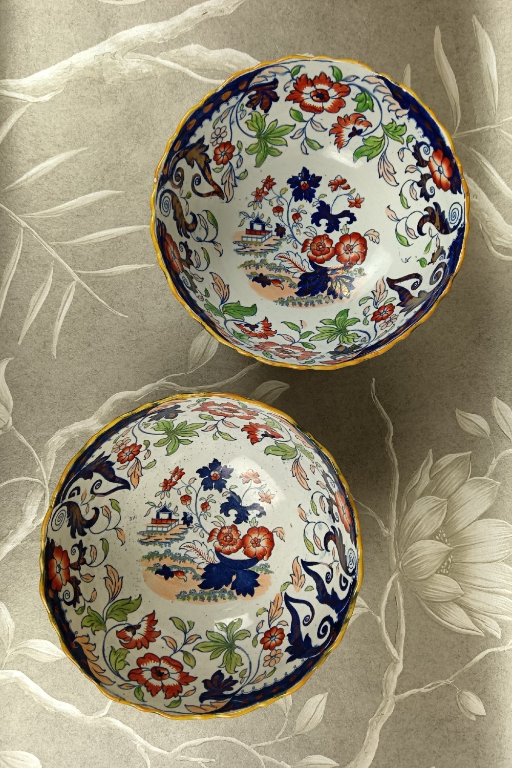 A pair of 19th-century Minton ironstone pedestal bowls with scalloped rims and vibrant Amherst Japan floral transfer pattern in cobalt blue, orange, and green. View VIII