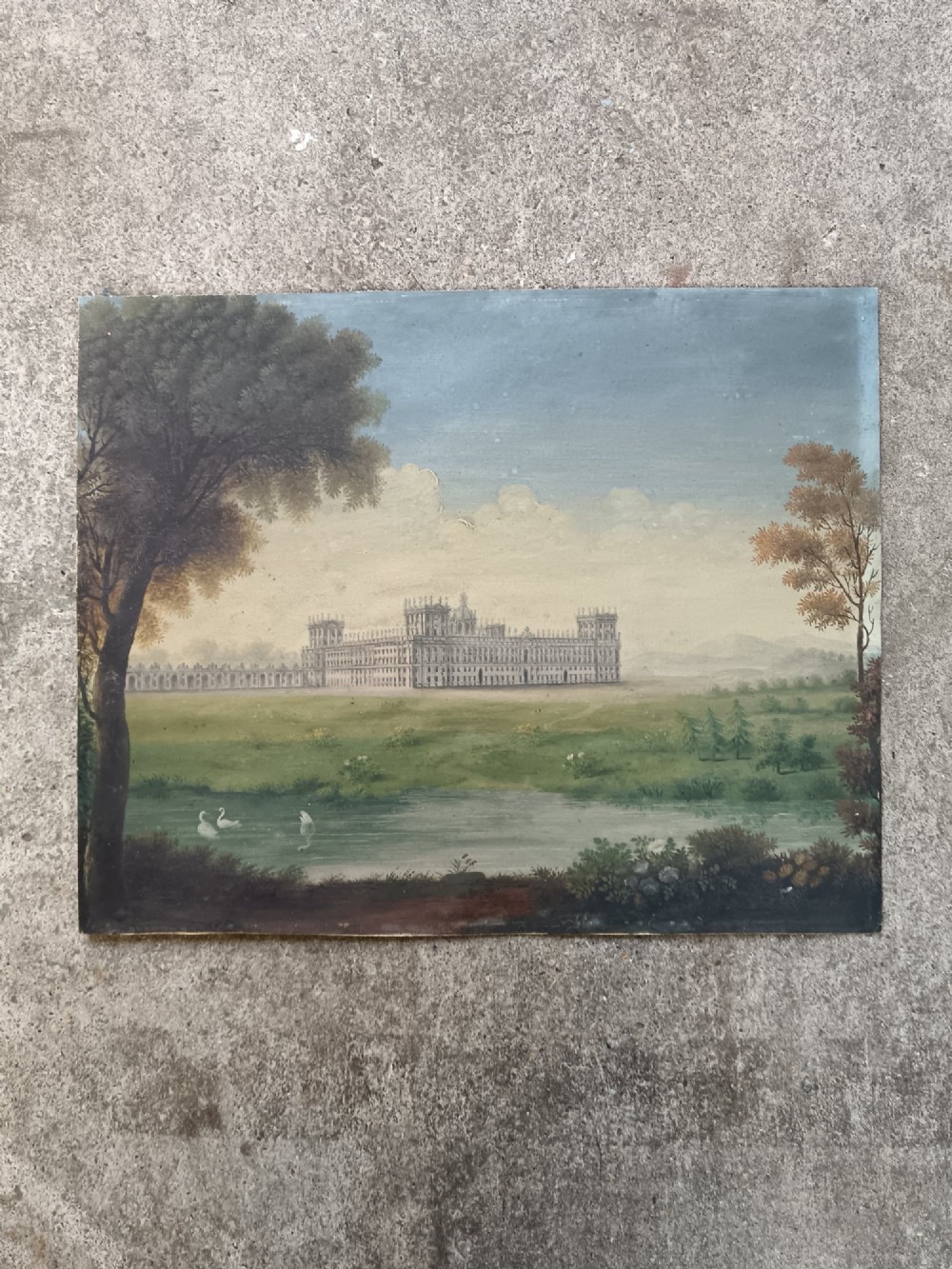 An early nineteenth-century gouache landscape painting depicting a grand palace behind a body of water with swans, presented in a light cream wood frame. View III