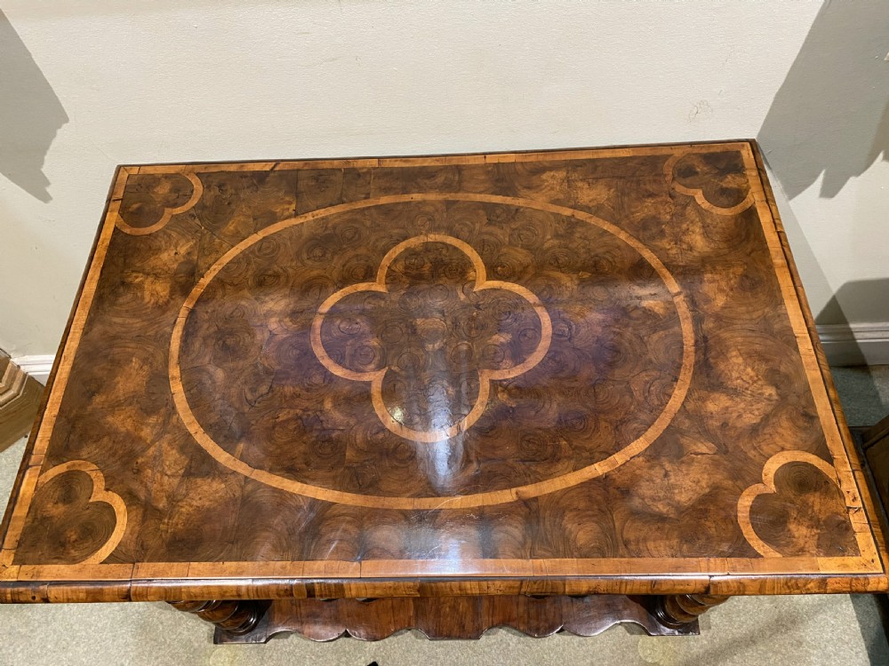 A William and Mary side table featuring an oyster olive veneer top with geometric holly inlays, spiral-turned legs, and shaped stretchers. View III