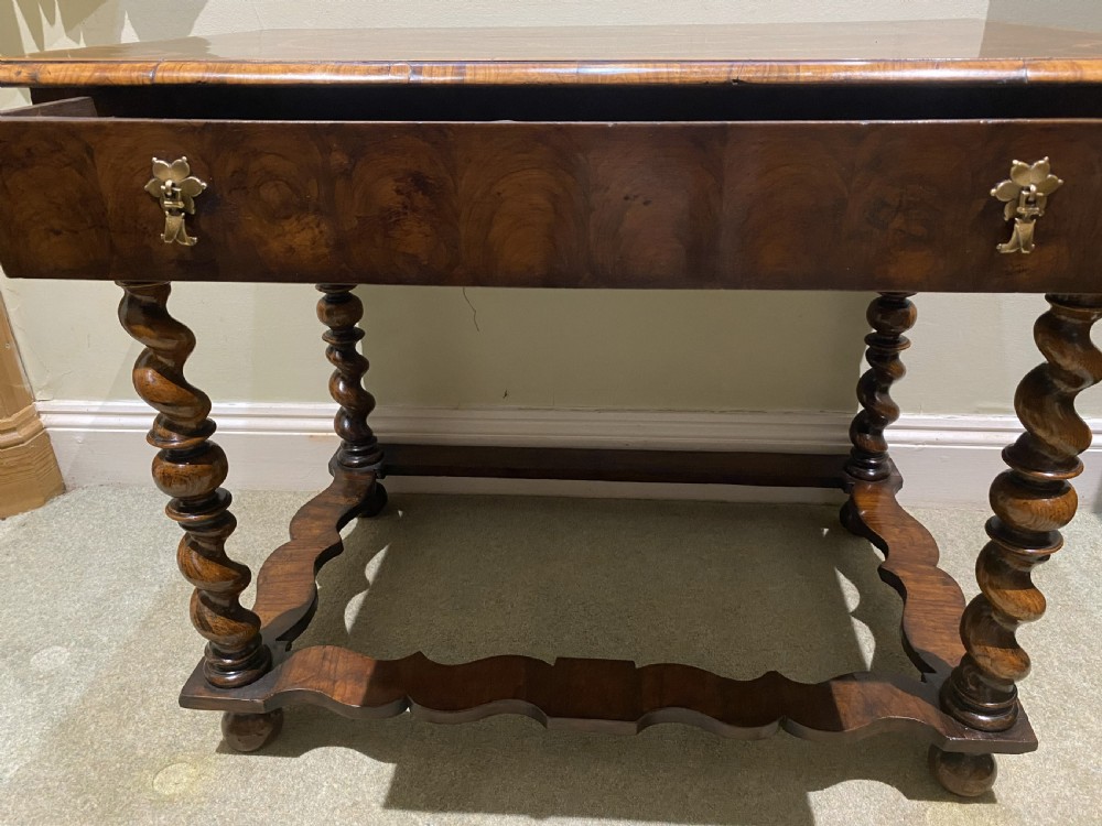 A William and Mary side table featuring an oyster olive veneer top with geometric holly inlays, spiral-turned legs, and shaped stretchers. View V