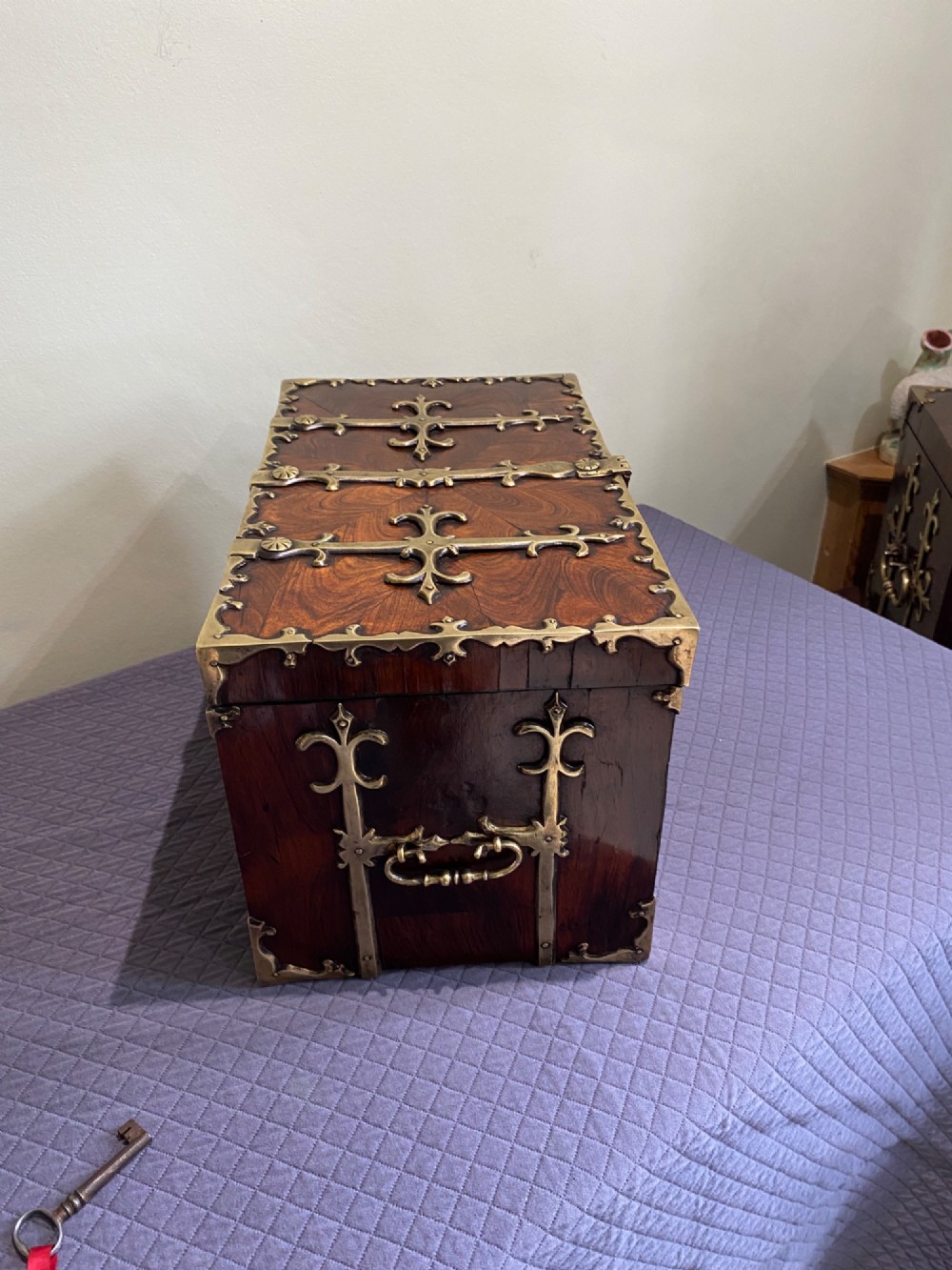 A rectangular late 17th-century William and Mary kingwood veneered coffre forte with pierced brass strapwork mounts and an accompanying brass key. View IV