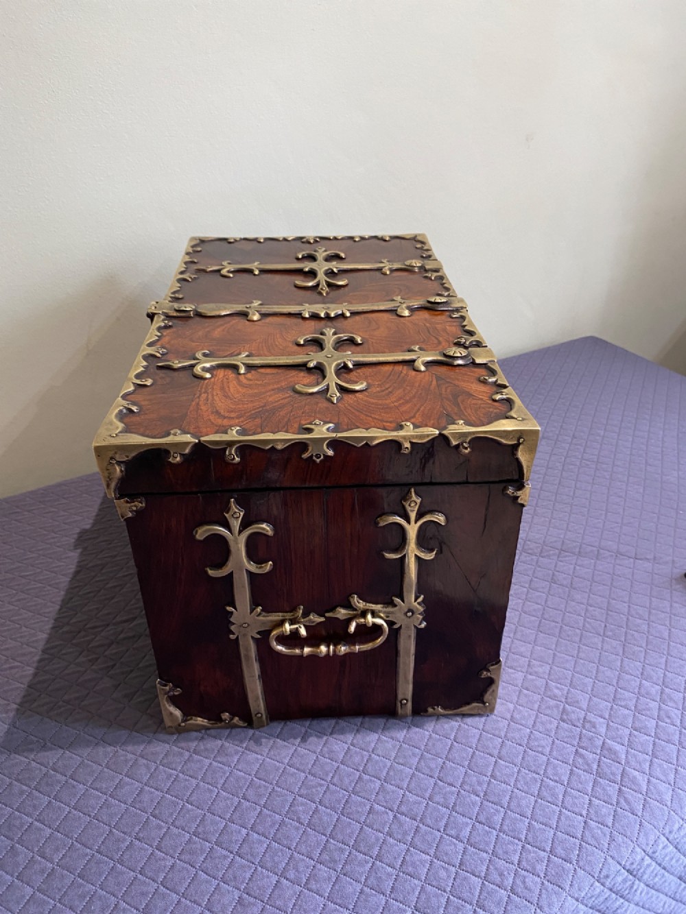 A rectangular late 17th-century William and Mary kingwood veneered coffre forte with pierced brass strapwork mounts and an accompanying brass key. View V