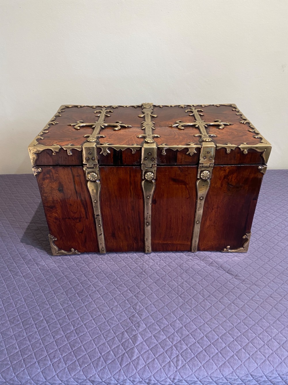 A rectangular late 17th-century William and Mary kingwood veneered coffre forte with pierced brass strapwork mounts and an accompanying brass key. View VI
