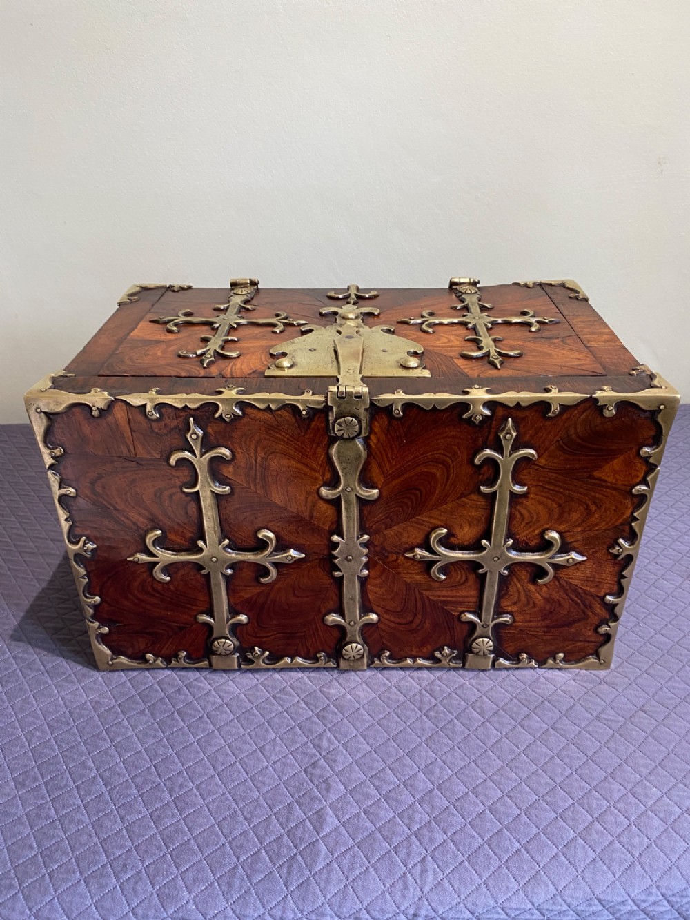 A rectangular late 17th-century William and Mary kingwood veneered coffre forte with pierced brass strapwork mounts and an accompanying brass key. View VII