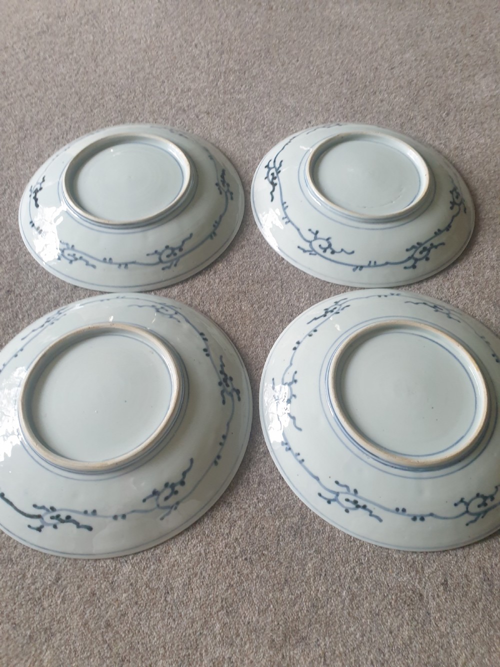 A set of four 19th-century Japanese Imari porcelain chargers decorated with intricate iron-red, cobalt blue, and gilded floral motifs. View III