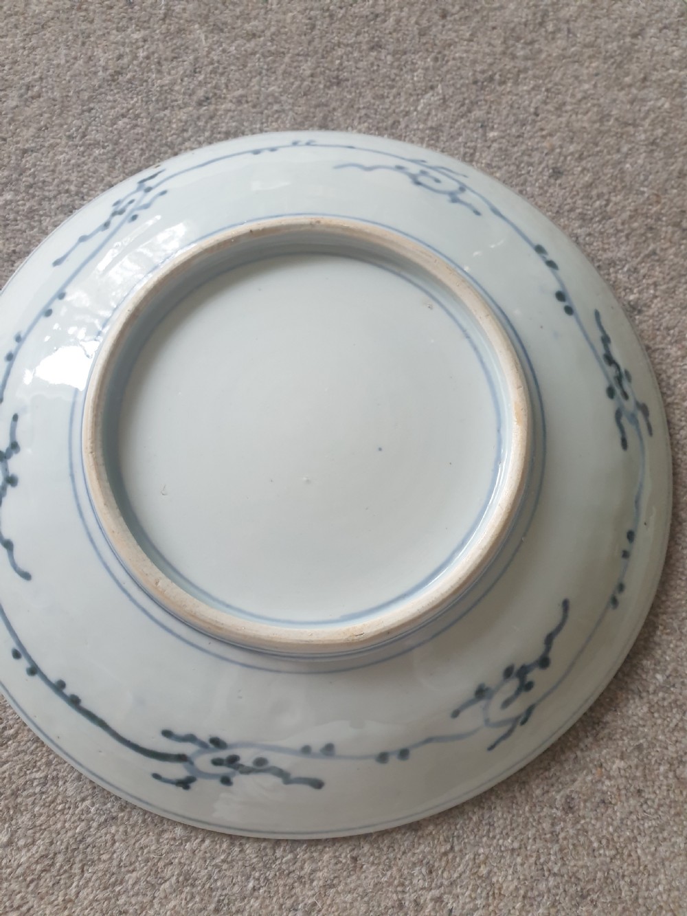 A set of four 19th-century Japanese Imari porcelain chargers decorated with intricate iron-red, cobalt blue, and gilded floral motifs. View IV