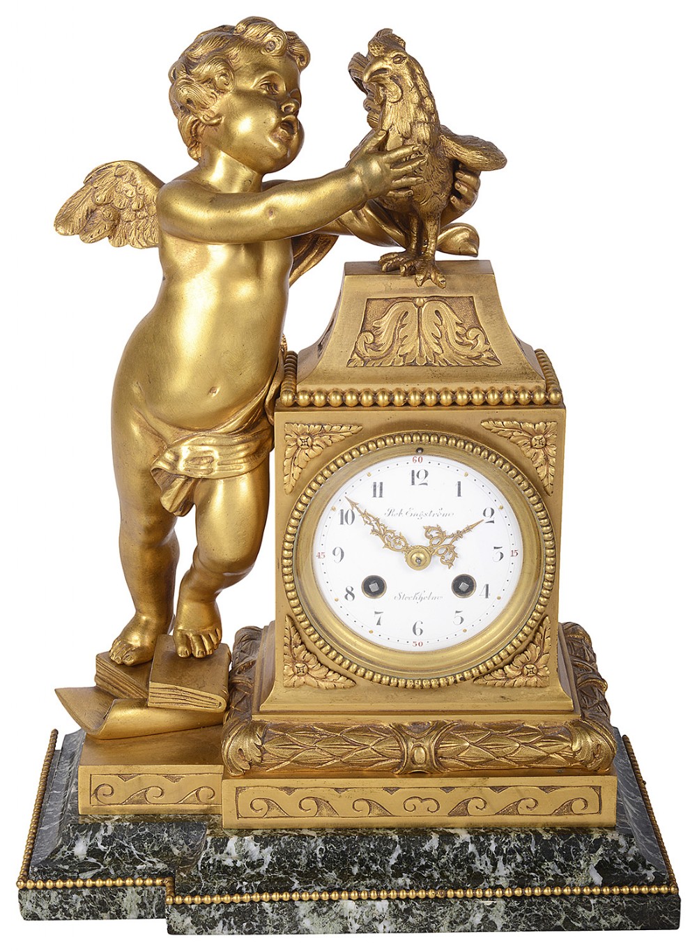An antique French gilt bronze mantel clock featuring a sculpted cherub holding a cockerel beside a white enamel dial set on a green marble base.