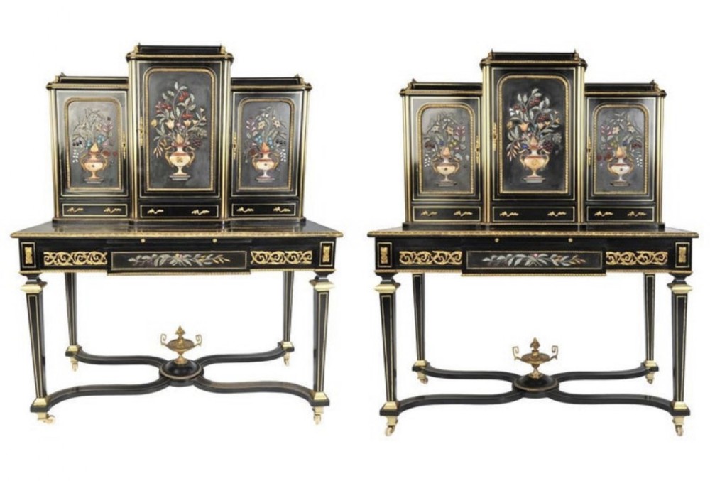 A pair of 19th-century French ebonised bonheur du jour writing desks with raised cabinets featuring floral pietra dura inlay plaques and gilt bronze mounts.