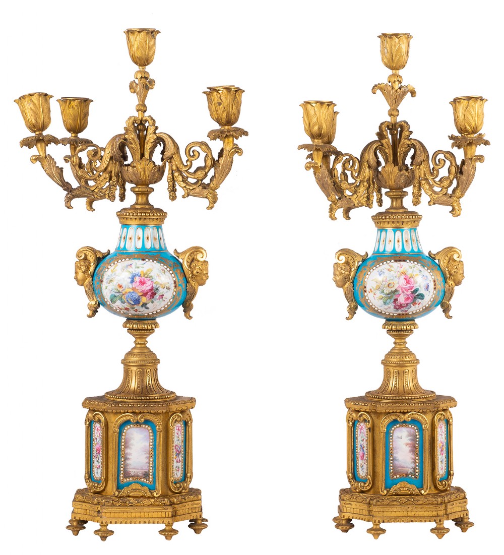 A pair of 19th-century French Sevres-style gilt bronze five-light candelabra with hand-painted turquoise floral porcelain urn bodies and bases.